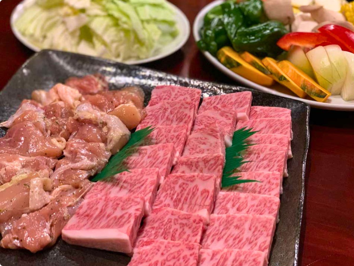 Wagyu beef and fresh vegetables prepared for grilling