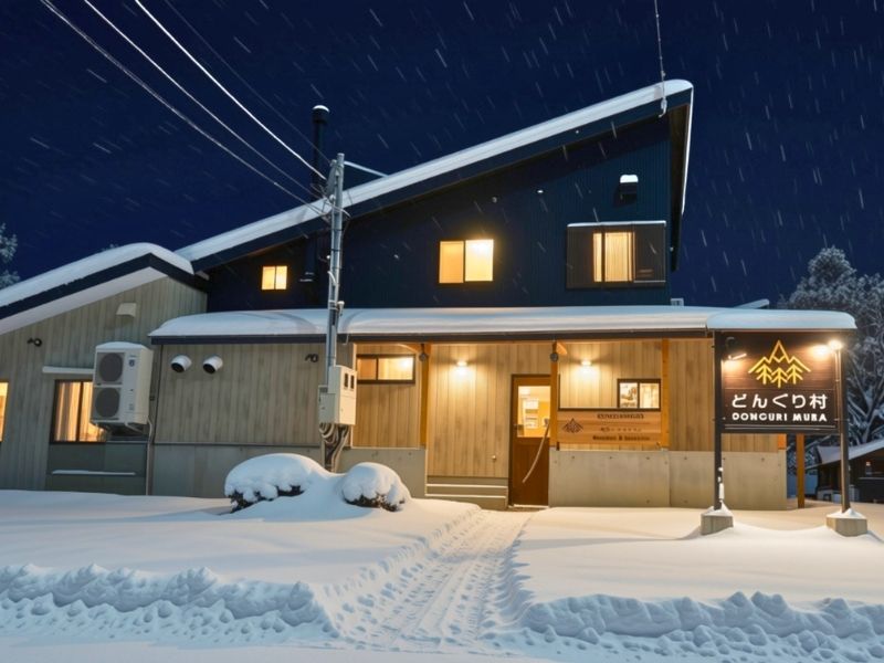 Donguri Mura reception building at night, surrounded by snow