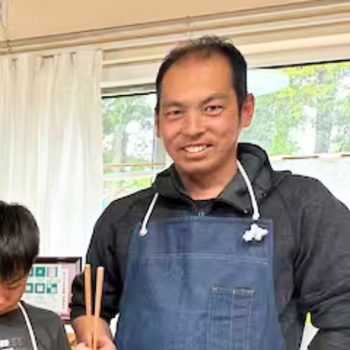 Donguritei owner smiling in the restaurant