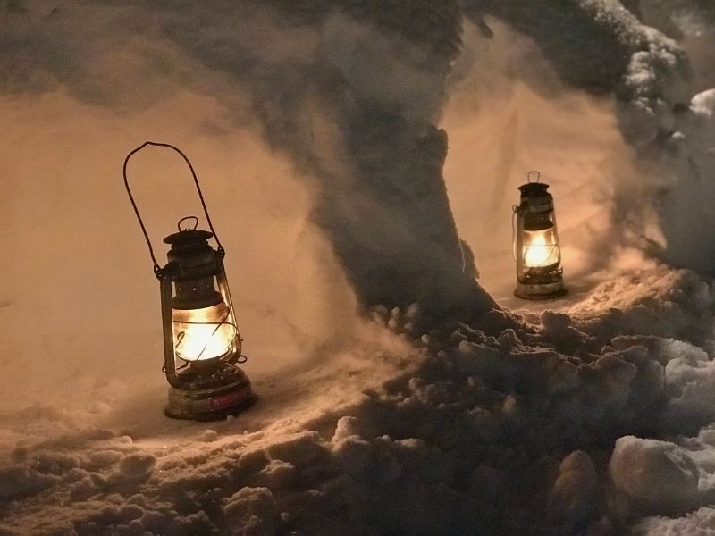 Snowy landscape at Madarao with a lantern glowing in the evening light