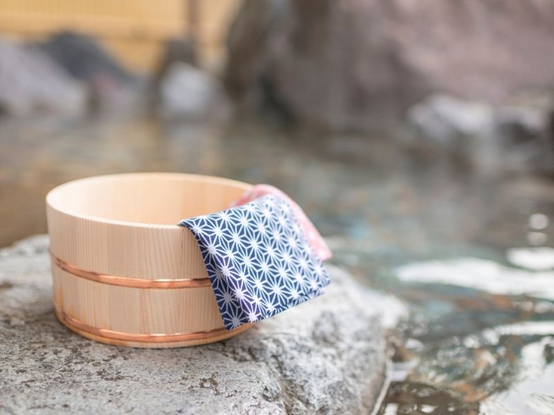 Wooden bucket and towel at a hot spring